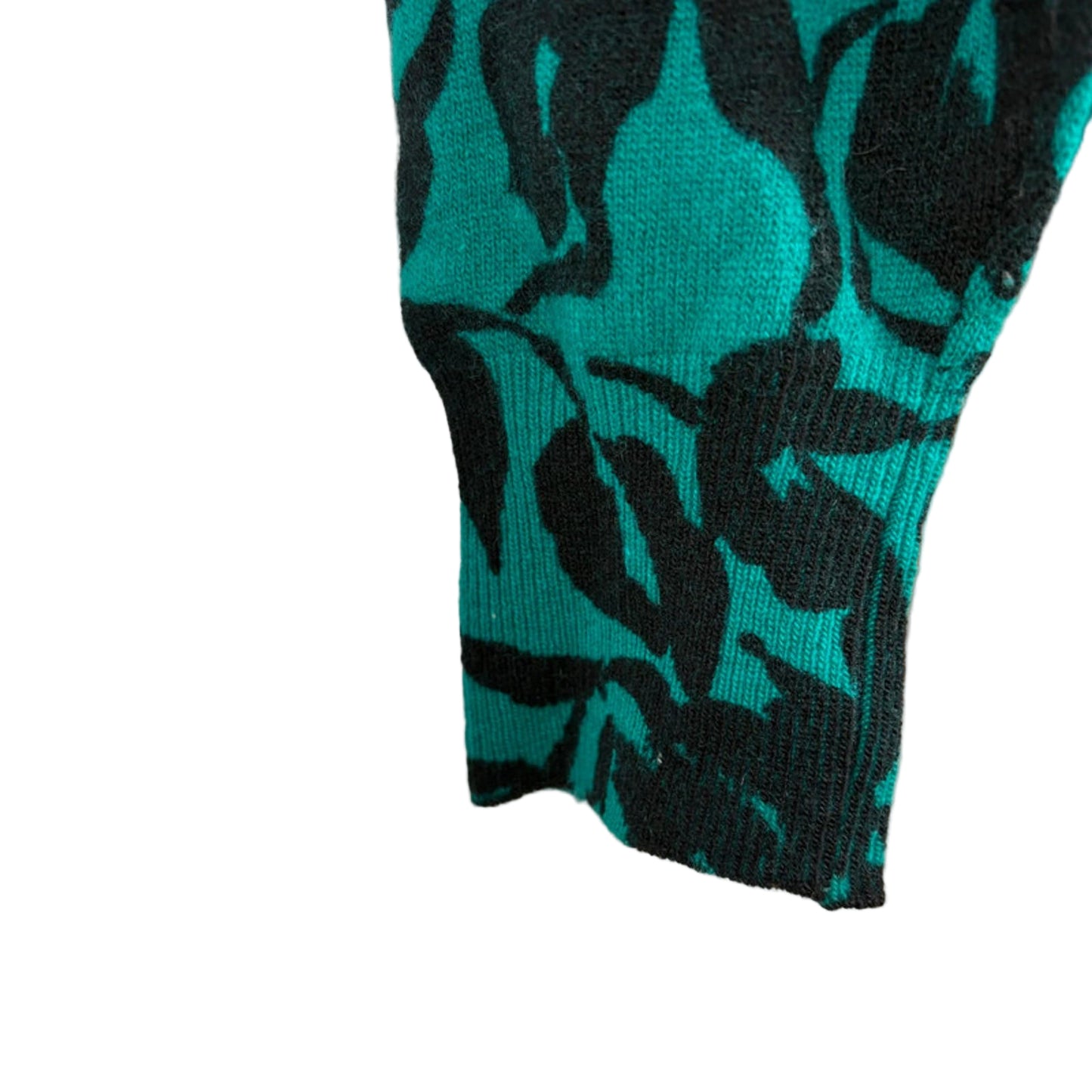 Teal and black patterned sleeve on a white background