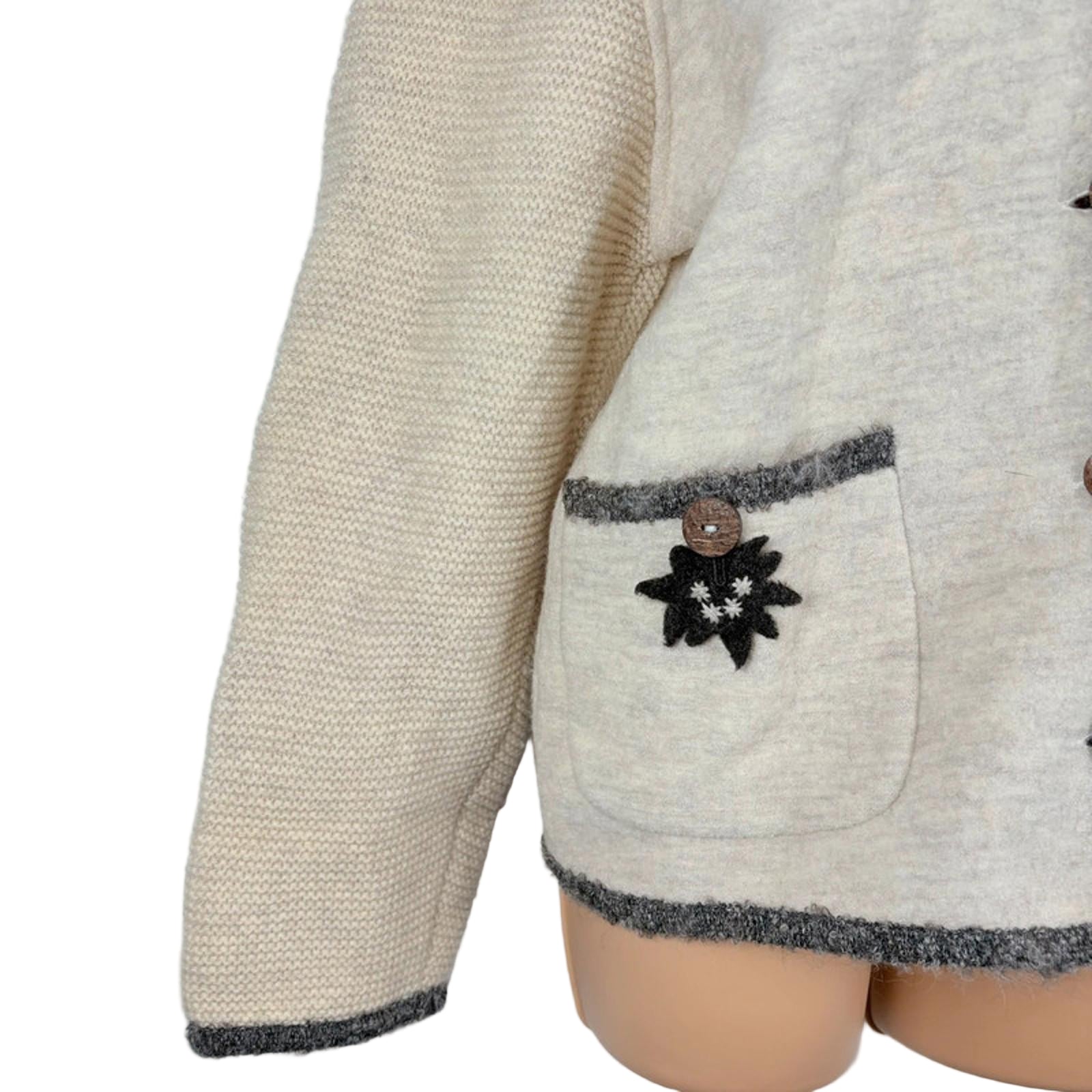 Beige textured jacket with a decorative pocket on a white background