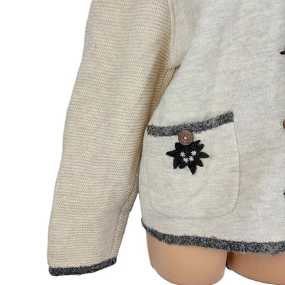 Beige textured jacket with a decorative pocket on a white background