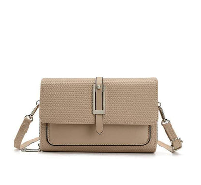 Beige handbag with a strap on a white background
