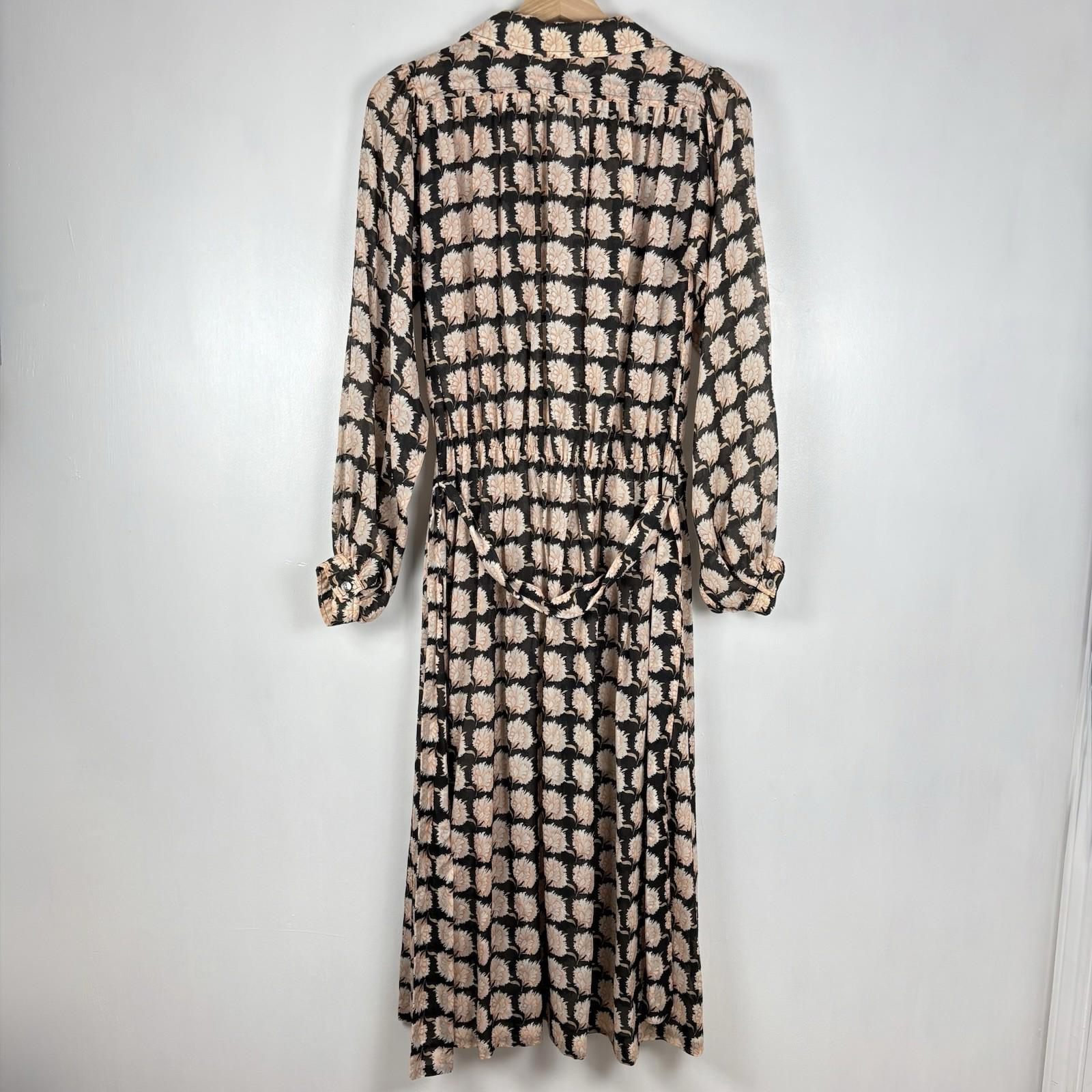 Long-sleeve dress with a black and beige pattern on a white background