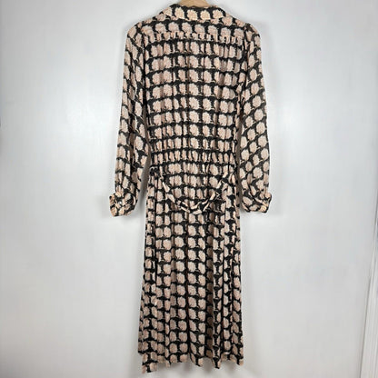 Long-sleeve dress with a black and beige pattern on a white background