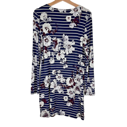 Navy striped dress with floral pattern on a hanger against a white background