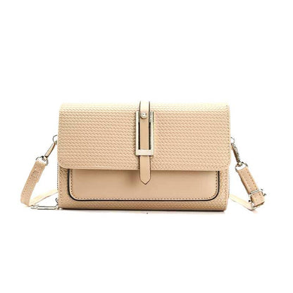 Beige woven handbag with a strap on a white background