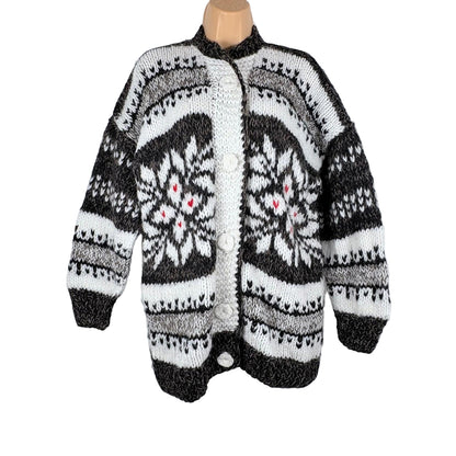 Knitted cardigan with a black and white pattern on a white background
