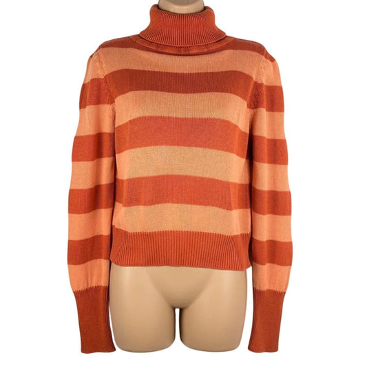 Orange and beige striped sweater on a mannequin against a white background