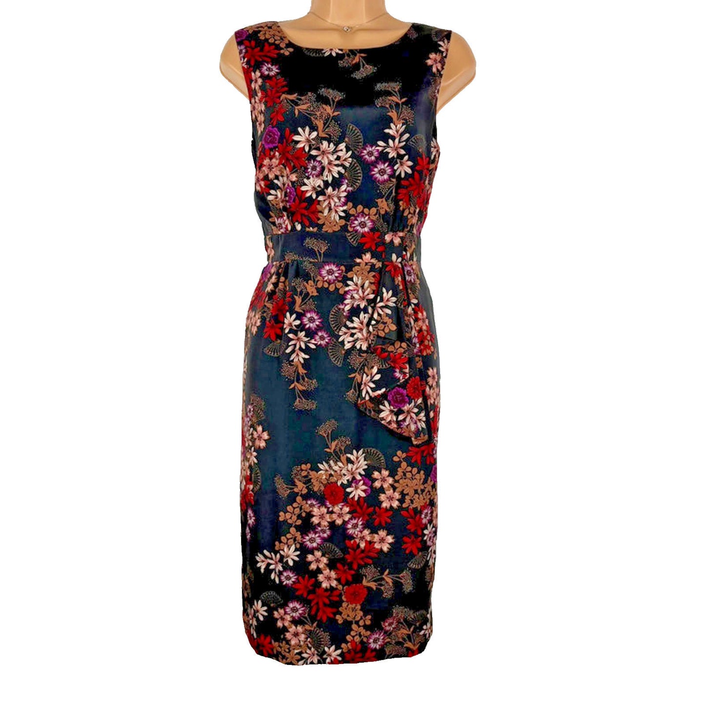 Floral patterned dress on a mannequin against a white background