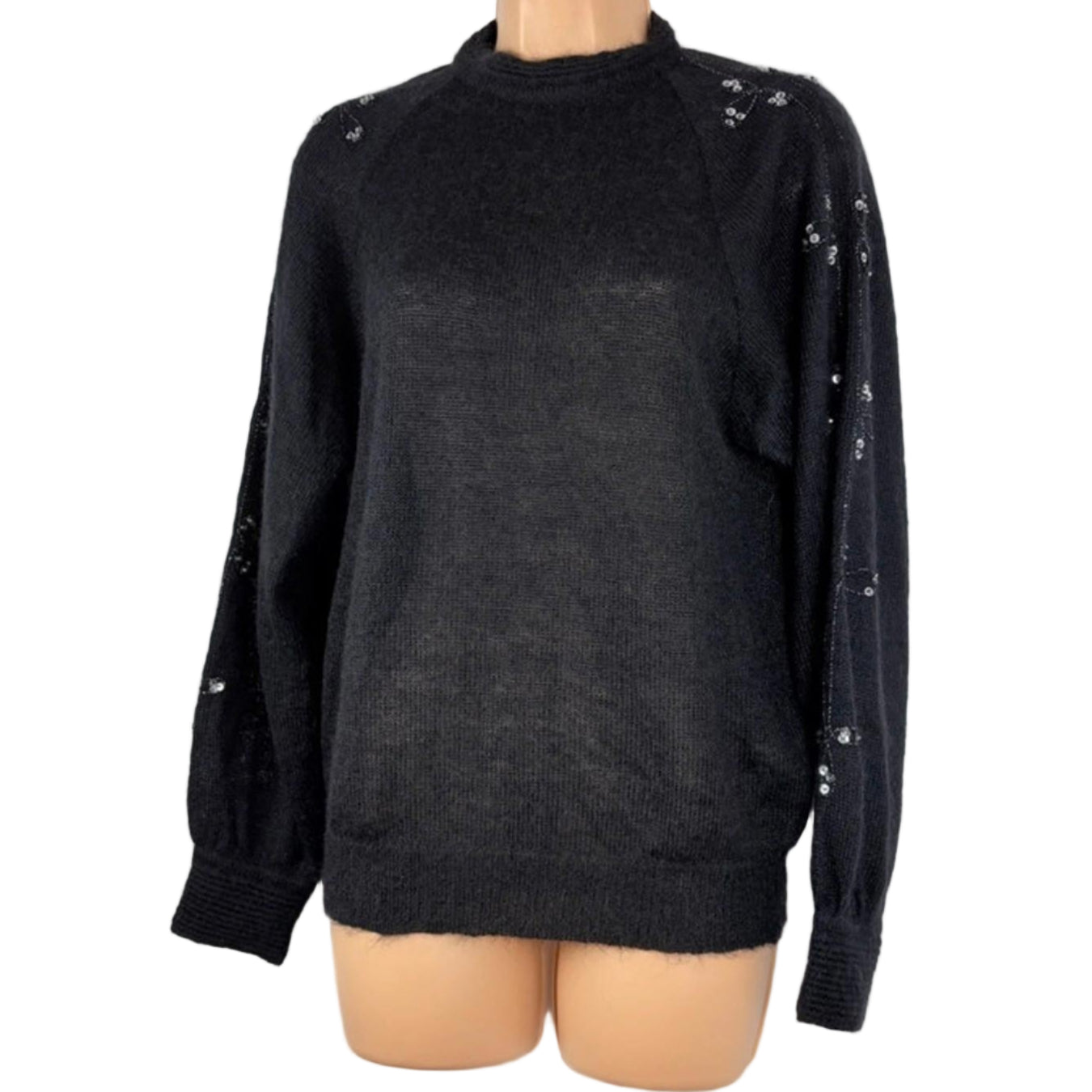 Black sweater with embellishments on a mannequin against a white background