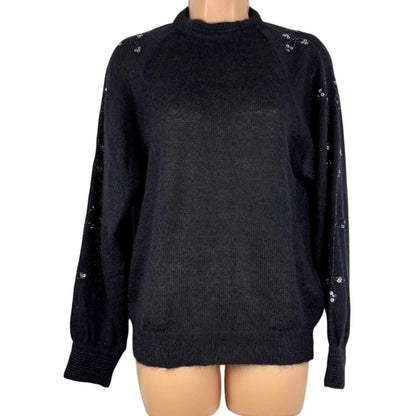 Black sweater on a mannequin with a white background