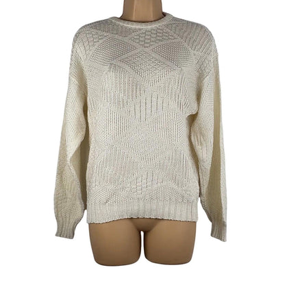 Beige knitted sweater on a mannequin against a white background