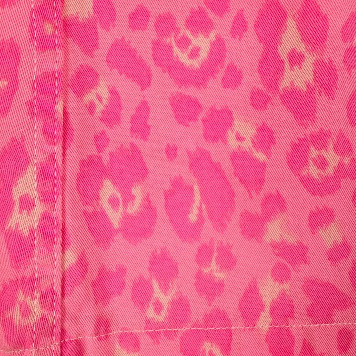 Close-up of pink fabric with a leopard print pattern