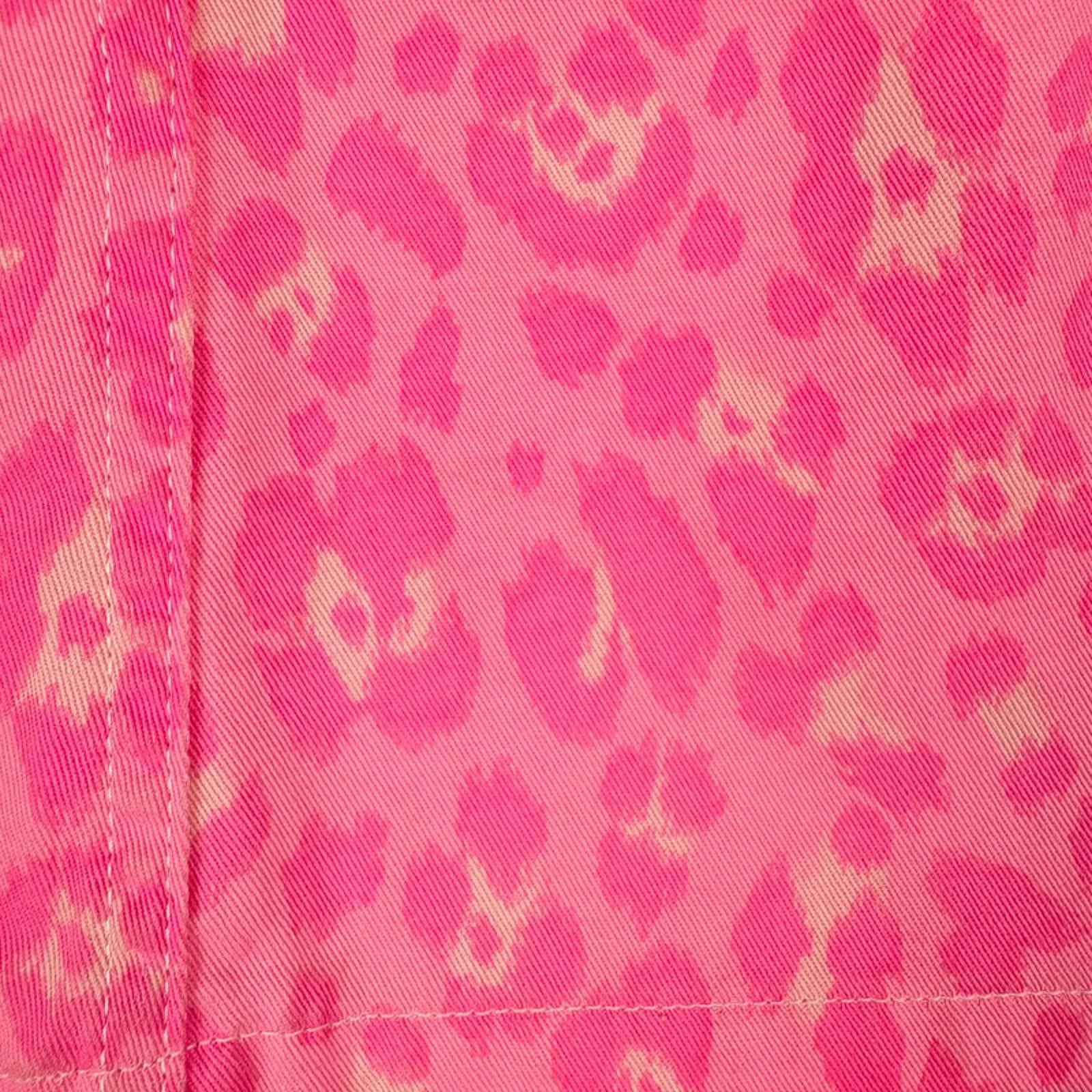 Close-up of pink fabric with a leopard print pattern
