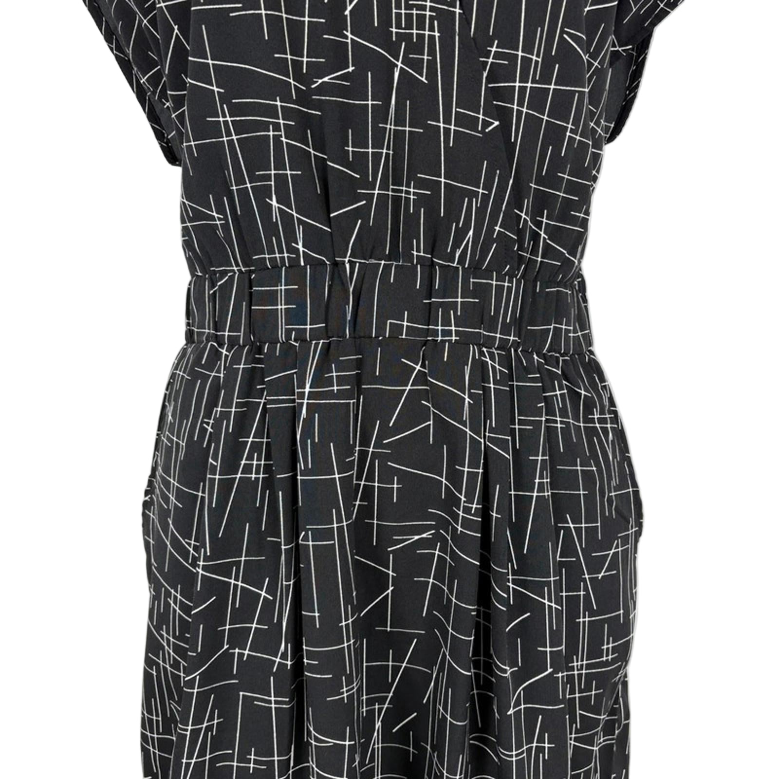 Black dress with white geometric pattern on a white background