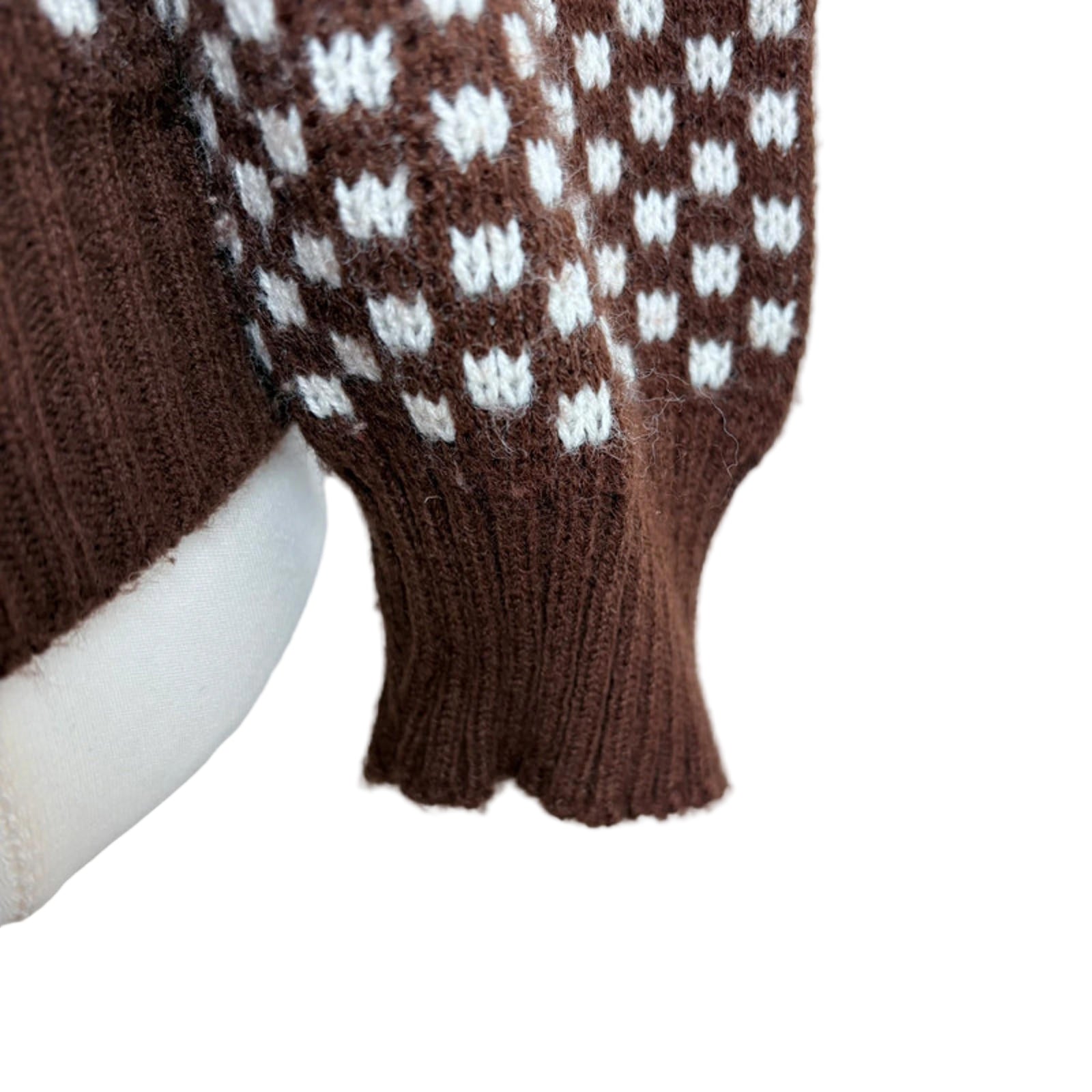 Brown jumper close up of sleeve