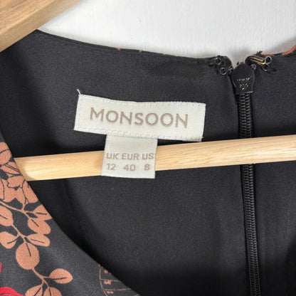 Black jacket with a Monsoon label on a hanger