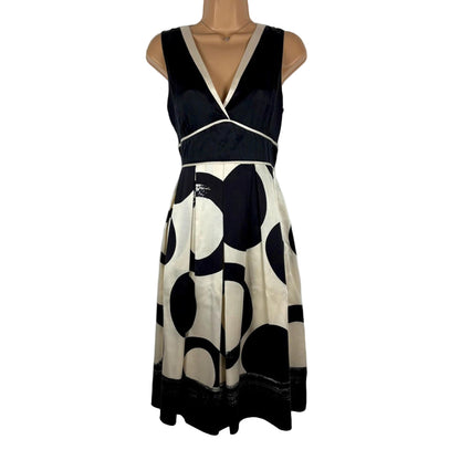 Black and white patterned dress on a mannequin against a white background