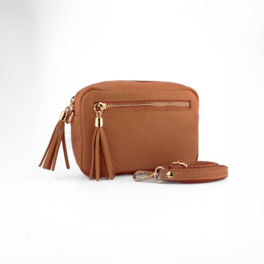 Brown leather crossbody bag with gold accents on a white background