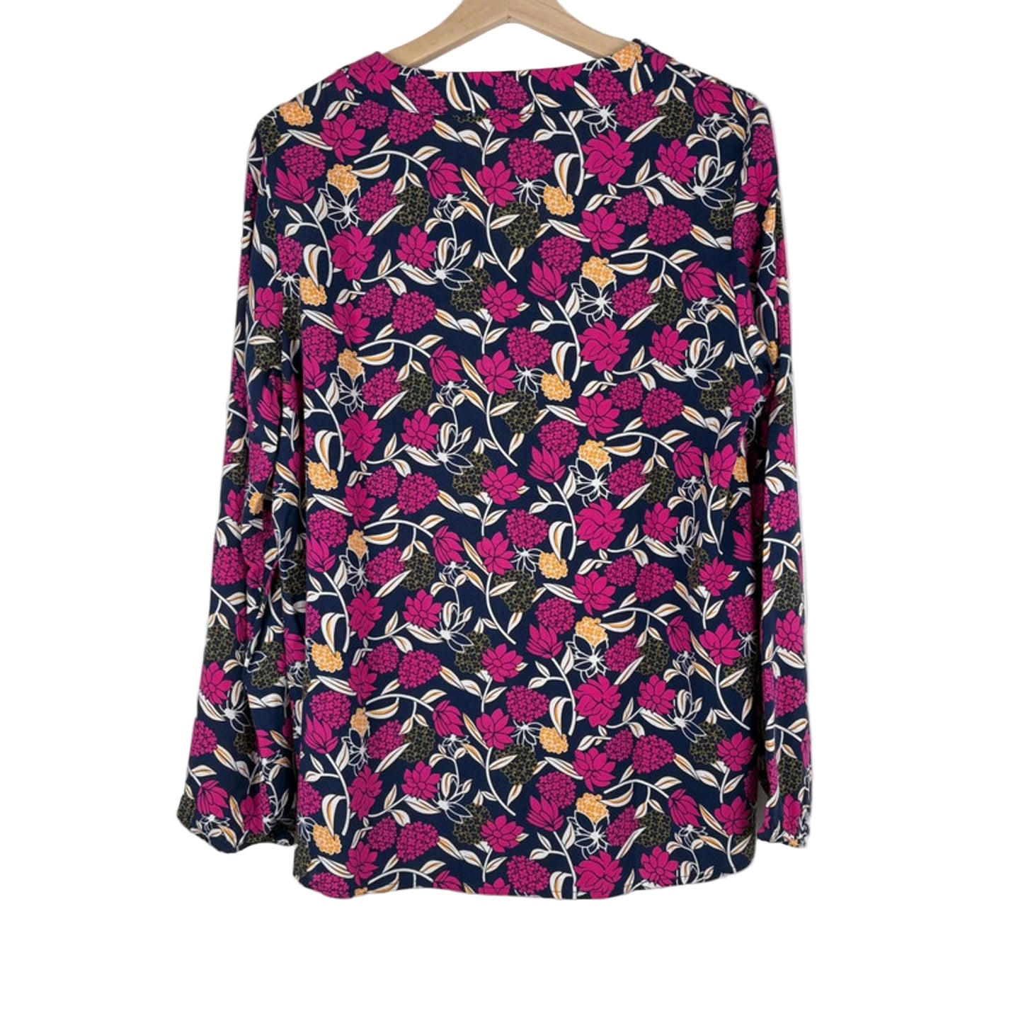 Floral patterned shirt on a hanger against a white background