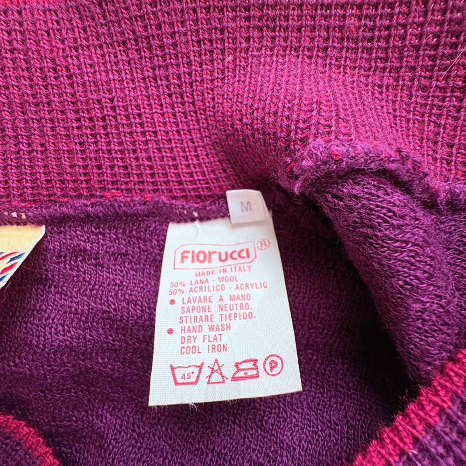 Close-up of a purple fabric with a Fiorucci label on it.