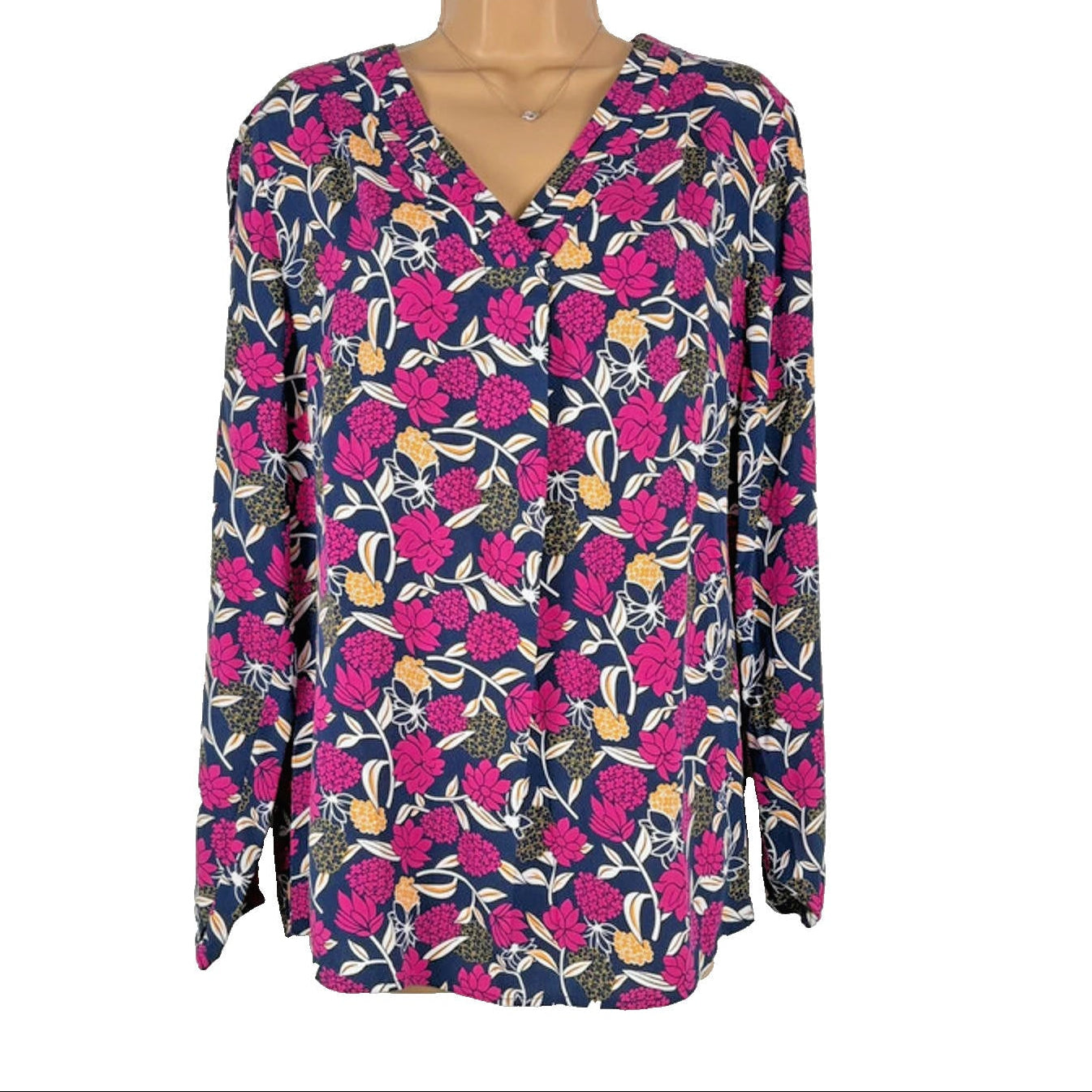 Floral patterned blouse on a mannequin against a white background